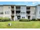 Apartment complex exterior with private balconies and well-maintained lawn at 404 Panorama Park Pl, Cary, NC 27519
