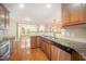 Kitchen with stainless steel appliances, granite countertops, and wooden cabinets at 404 Panorama Park Pl, Cary, NC 27519