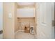 Laundry room featuring built in cabinets, tile flooring and a utility closet at 404 Panorama Park Pl, Cary, NC 27519