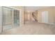Spacious living room with neutral carpet and a view of the entry and staircase at 404 Panorama Park Pl, Cary, NC 27519