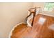Elegant curved staircase with hardwood steps and white railing and wooden banister at 404 Panorama Park Pl, Cary, NC 27519