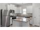 Modern kitchen with stainless steel appliances and granite countertops at 405 Benton Dr, Oxford, NC 27565