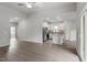 Open-concept living area with wood-look floors and eat-in kitchen at 405 Benton Dr, Oxford, NC 27565