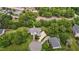 A sprawling home sits on a beautifully landscaped lot with mature trees and winding driveways at 4315 Sugar Pine Ln, Durham, NC 27705
