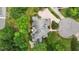 A large, well-maintained home sits nestled among mature trees and lush landscaping at 4315 Sugar Pine Ln, Durham, NC 27705