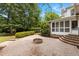 An ornate backyard patio area features an in-ground fire pit and several tiers at 4315 Sugar Pine Ln, Durham, NC 27705