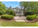 A large backyard patio features a fire pit and lush landscaping surrounding the home at 4315 Sugar Pine Ln, Durham, NC 27705