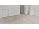 Basement area features neutral carpet, white walls, and multiple doorways leading to other rooms at 4315 Sugar Pine Ln, Durham, NC 27705