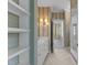 Bright bathroom features marble countertops, white cabinets, and a view into the shower at 4315 Sugar Pine Ln, Durham, NC 27705