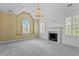 Spacious bedroom featuring a chandelier, fireplace, and windows with decorative shutters at 4315 Sugar Pine Ln, Durham, NC 27705