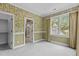 Bedroom with wallpaper, olive and white trim, and an ensuite bathroom at 4315 Sugar Pine Ln, Durham, NC 27705