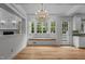 Bright breakfast nook features hardwood floors, window seat, and elegant chandelier at 4315 Sugar Pine Ln, Durham, NC 27705
