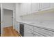 Butler pantry featuring white cabinets, wine cooler and plenty of storage at 4315 Sugar Pine Ln, Durham, NC 27705