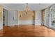 Formal dining room with hardwood floors, wainscoting, and a chandelier fixture at 4315 Sugar Pine Ln, Durham, NC 27705