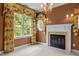 Primary bedroom fireplace with arched windows and beautiful floral valances at 4315 Sugar Pine Ln, Durham, NC 27705