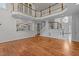 Grand foyer featuring hardwood floors, stairs, a chandelier, and views of the open concept kitchen at 4315 Sugar Pine Ln, Durham, NC 27705