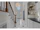 Elegant foyer with marble floors, chandelier, and a grand staircase leading to the upper level at 4315 Sugar Pine Ln, Durham, NC 27705
