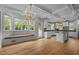 Eat-in kitchen with a window seat, white cabinets, an island, and stainless steel appliances at 4315 Sugar Pine Ln, Durham, NC 27705