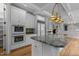Elegant kitchen featuring granite countertops, stainless steel appliances, and a large island for cooking at 4315 Sugar Pine Ln, Durham, NC 27705