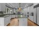 Bright kitchen featuring a center island, stainless steel appliances, and ample counter space at 4315 Sugar Pine Ln, Durham, NC 27705