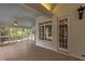 View of a porch with multiple windows, ceiling fan and natural light at 4315 Sugar Pine Ln, Durham, NC 27705