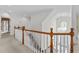 Bright foyer and staircase features a chandelier and hardwood railing with white spindles at 4315 Sugar Pine Ln, Durham, NC 27705
