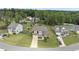 An aerial view shows a two-story home situated in a well-maintained neighborhood with green lawns and mature trees at 433 Village Bend Dr, Fuquay Varina, NC 27526