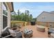 A view of the wooden back deck furnished with trendy outdoor seating and a barbecue grill at 433 Village Bend Dr, Fuquay Varina, NC 27526