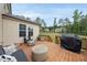 A view of the wooden back deck furnished with trendy outdoor seating and a barbecue grill at 433 Village Bend Dr, Fuquay Varina, NC 27526