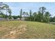 A large backyard extends from the back of the home to a boundary fence, offering plenty of open space at 433 Village Bend Dr, Fuquay Varina, NC 27526