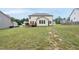 A large backyard extends from the back of the home to a boundary fence, offering plenty of open space at 433 Village Bend Dr, Fuquay Varina, NC 27526