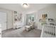 Bright Bedroom with crib, chair and ottoman, storage and cheerful decor at 433 Village Bend Dr, Fuquay Varina, NC 27526