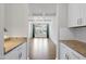 Dining room featuring coffered ceiling detail and hardwood floors at 433 Village Bend Dr, Fuquay Varina, NC 27526