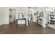 Open foyer featuring hardwood floors, a console table with a mirror, and views into other rooms at 433 Village Bend Dr, Fuquay Varina, NC 27526