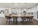 Bright kitchen features an oversized island with pendant lighting and seating at 433 Village Bend Dr, Fuquay Varina, NC 27526