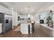 Open floor plan showcases stainless steel appliances and expansive kitchen island at 433 Village Bend Dr, Fuquay Varina, NC 27526