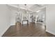 Bright and spacious living room with hardwood floors, leading to an office and kitchen at 433 Village Bend Dr, Fuquay Varina, NC 27526