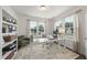 Inviting home office filled with natural light and featuring a large white desk and a comfortable chair at 433 Village Bend Dr, Fuquay Varina, NC 27526