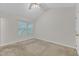 Cozy bedroom featuring a ceiling fan and double hung windows at 4825 Windbreak Ln, Raleigh, NC 27616