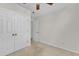 Bedroom featuring neutral walls, carpet and a closet with double doors at 4825 Windbreak Ln, Raleigh, NC 27616