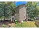 The home's exterior features neutral siding, established trees, and a well-maintained lawn at 4825 Windbreak Ln, Raleigh, NC 27616