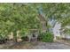 Charming two-story home with a well-maintained front yard and a classic facade, showcasing its inviting curb appeal at 4825 Windbreak Ln, Raleigh, NC 27616