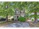 Charming two-story home with a well-maintained front yard and a classic facade, showcasing its inviting curb appeal at 4825 Windbreak Ln, Raleigh, NC 27616