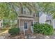 Charming two-story home with a well-maintained front yard and a classic facade, showcasing its inviting curb appeal at 4825 Windbreak Ln, Raleigh, NC 27616