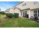 Cozy backyard patio with manicured bushes and room for entertaining at 4826 Sir Duncan Way, Raleigh, NC 27612