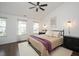 Bright bedroom with large windows, hardwood floors, and neutral decor at 4826 Sir Duncan Way, Raleigh, NC 27612