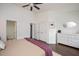 Bedroom with white dresser and a view into a bathroom at 4826 Sir Duncan Way, Raleigh, NC 27612