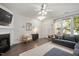 Comfortable living room with a fireplace, stylish decor, and plenty of natural light at 4826 Sir Duncan Way, Raleigh, NC 27612