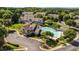 Aerial view of the community pool surrounded by lush trees and townhome properties at 4826 Sir Duncan Way, Raleigh, NC 27612