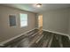 A charming bedroom with modern gray vinyl flooring and a bright, natural light at 511 Commonwealth St, Durham, NC 27703